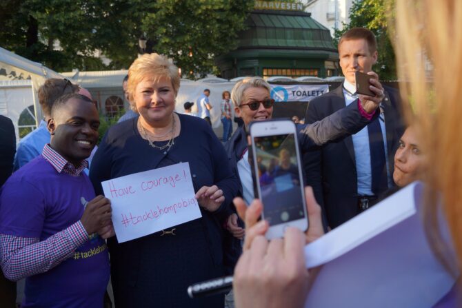 Norwegian Prime Minister Erna Solberg and SMUG Director Frank Mugisha met at the Oslo Pride in June 2016, where she joined the campaign against homophobia in football, #tacklehomophobia.